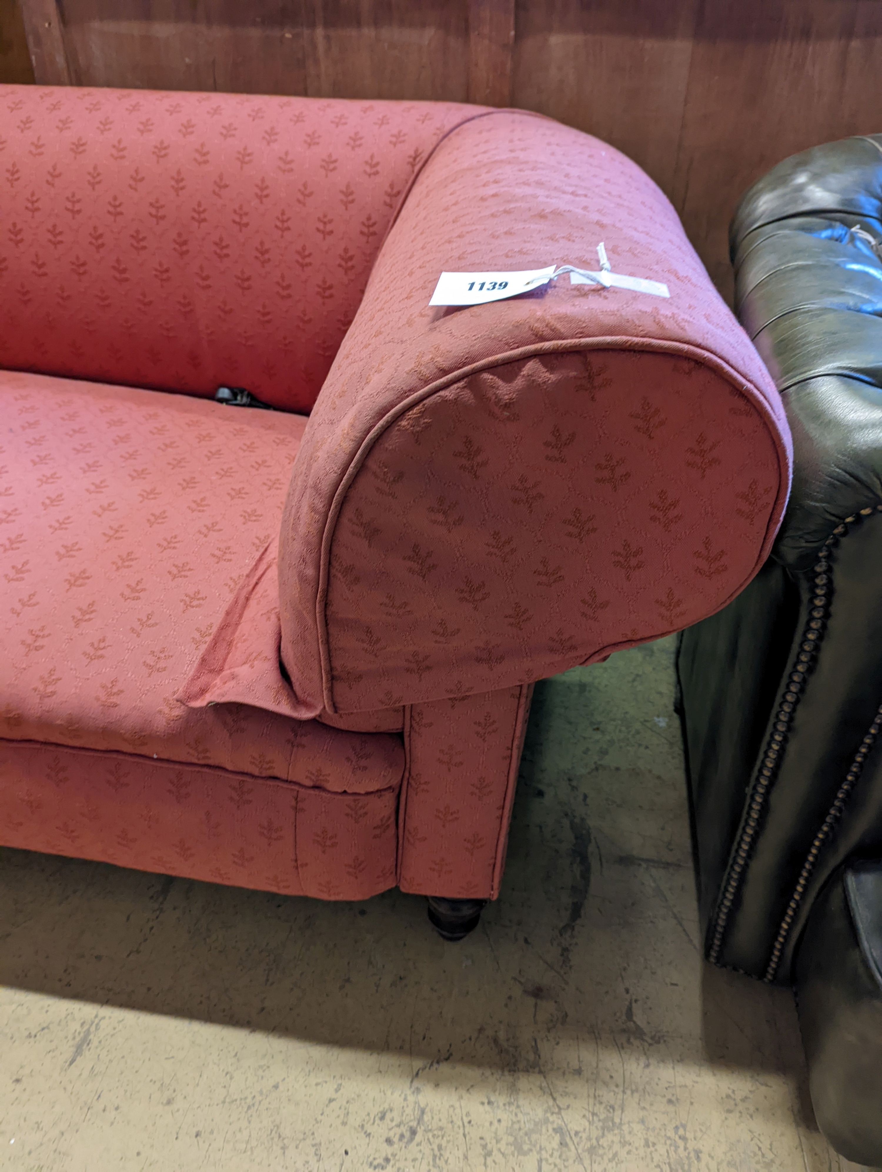 A Victorian red upholstered chesterfield settee, length 202cm, depth 92cm, height 72cm